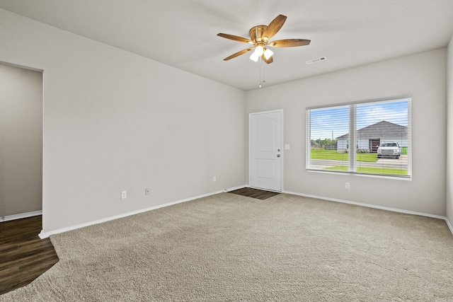 116 Baldwin Dr, Beebe, AR 72012 - spare room with a ceiling fan and dark carpet