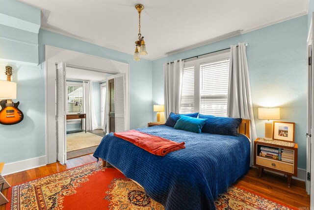 127 W F Ave, North Little Rock, AR 72116 - bedroom featuring wood finished floors and crown molding