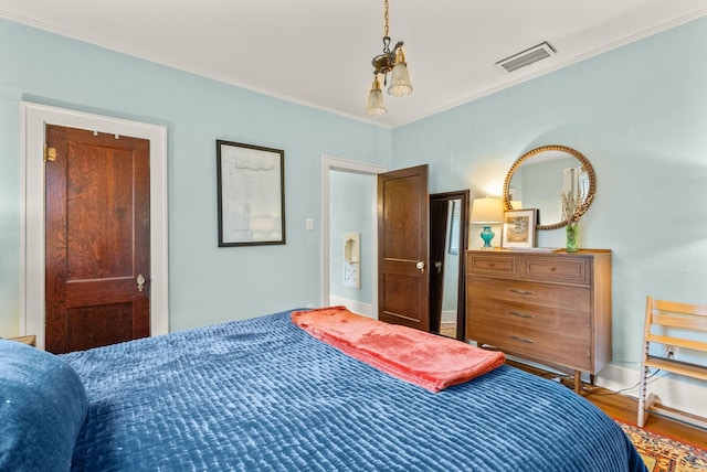 127 W F Ave, North Little Rock, AR 72116 - bedroom featuring crown molding and wood finished floors