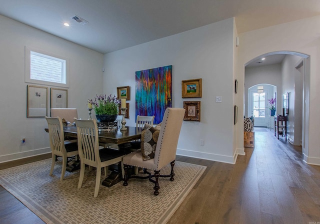 101 Mergeron Ct, Little Rock, AR 72212 - dining room featuring arched walkways, dark wood-style floors, and recessed lighting