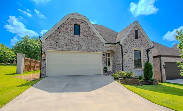 101 Mergeron Ct, Little Rock, AR 72212 - view of front of house with a garage, concrete driveway, brick siding, and roof with shingles