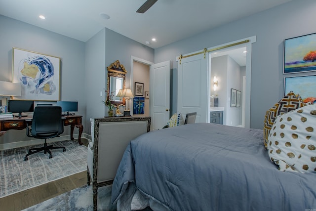 101 Mergeron Ct, Little Rock, AR 72212 - bedroom featuring wood finished floors, a barn door, ensuite bath, recessed lighting, and ceiling fan