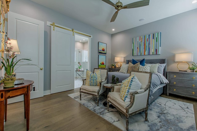 101 Mergeron Ct, Little Rock, AR 72212 - bedroom with a barn door, wood finished floors, recessed lighting, and ceiling fan