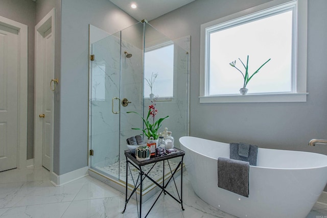 101 Mergeron Ct, Little Rock, AR 72212 - bathroom featuring a marble finish shower, marble look tile flooring, and a freestanding tub