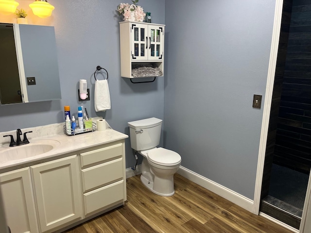 758 Barren Fork Rd, Mount Pleasant, AR 72561 - bathroom featuring wood finished floors, vanity, and a tile shower