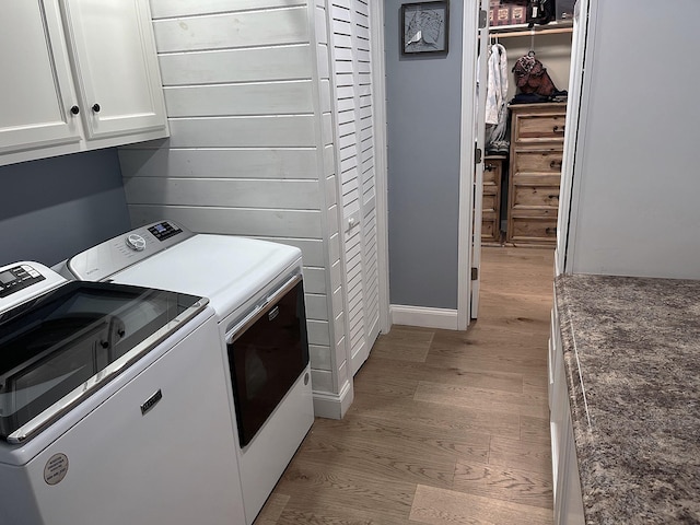 758 Barren Fork Rd, Mount Pleasant, AR 72561 - laundry room featuring cabinet space, washer and dryer, and light wood-type flooring