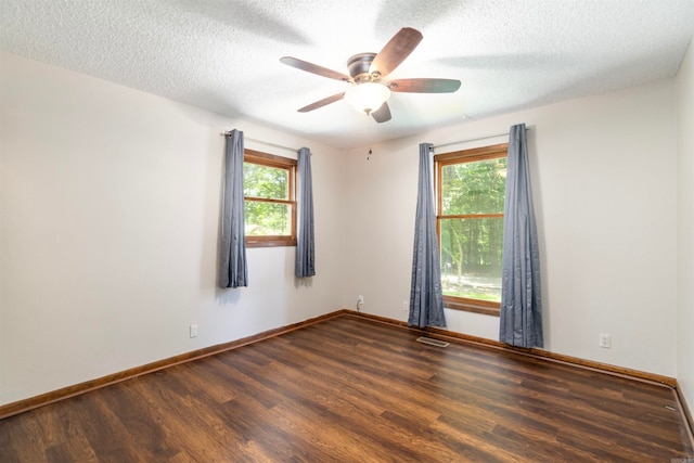 1 Bahia Ln, Hot Springs Village, AR 71909 - empty room with wood finished floors, plenty of natural light, ceiling fan, and a textured ceiling
