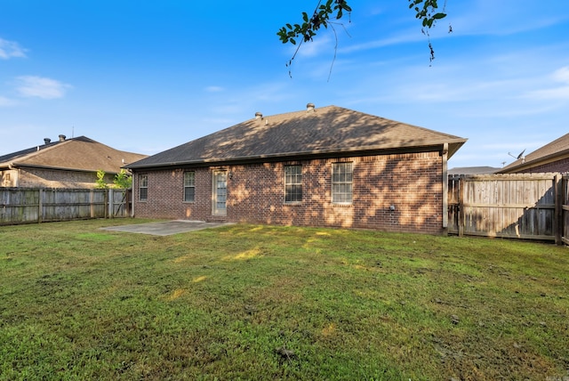 970 Wineberry, Conway, AR 72034 - rear view of house featuring brick siding, a patio area, a fenced backyard, and roof with shingles