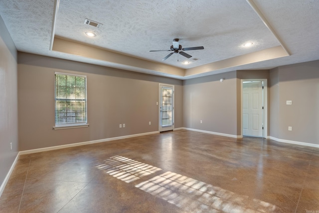 970 Wineberry, Conway, AR 72034 - spare room featuring a raised ceiling, finished concrete flooring, a textured ceiling, ceiling fan, and recessed lighting