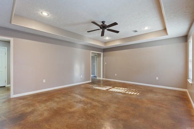 970 Wineberry, Conway, AR 72034 - spare room featuring a raised ceiling, a ceiling fan, a textured ceiling, and recessed lighting