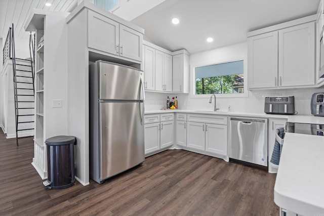 99Rogers Drive, Bryant, AR 72022 - kitchen featuring stainless steel appliances, dark wood-style flooring, backsplash, light countertops, and recessed lighting