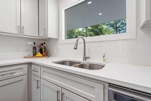 99Rogers Drive, Bryant, AR 72022 - kitchen featuring decorative backsplash, dishwashing machine, and light stone countertops