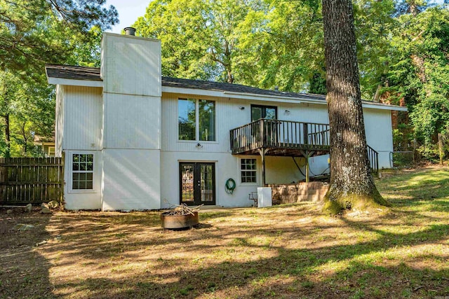 99Rogers Drive, Bryant, AR 72022 - back of house featuring french doors, a deck, an outdoor fire pit, and a chimney