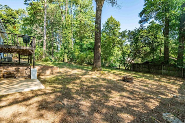99Rogers Drive, Bryant, AR 72022 - fenced yard featuring a deck, a fire pit, and a patio