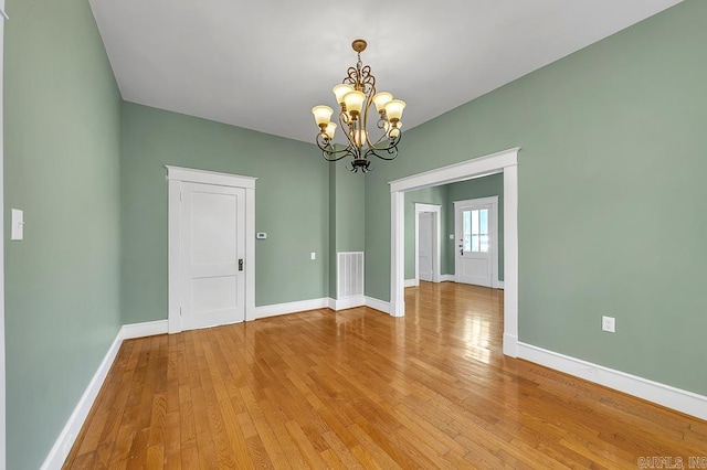 408 N 3rd St, Cabot, AR 72023 - empty room featuring a chandelier and light wood-type flooring