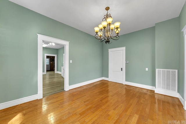 408 N 3rd St, Cabot, AR 72023 - empty room featuring light wood finished floors and a chandelier