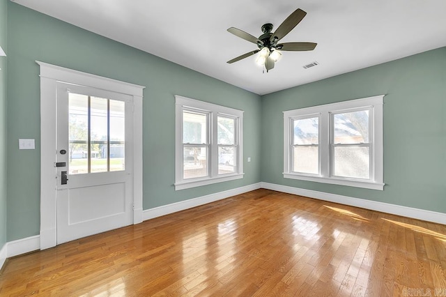 408 N 3rd St, Cabot, AR 72023 - spare room with plenty of natural light, wood finished floors, and ceiling fan