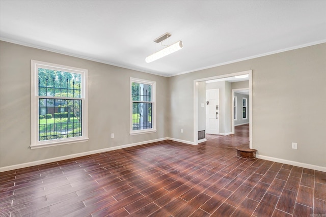 900 Melton Dr, Jonesboro, AR 72401 - empty room featuring crown molding, healthy amount of natural light, and dark wood finished floors