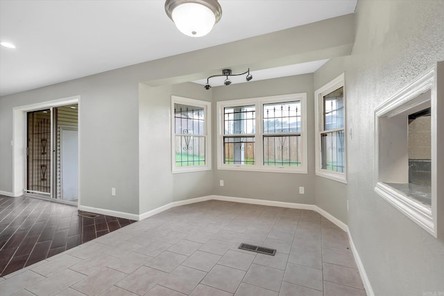 900 Melton Dr, Jonesboro, AR 72401 - spare room featuring baseboards and tile patterned flooring