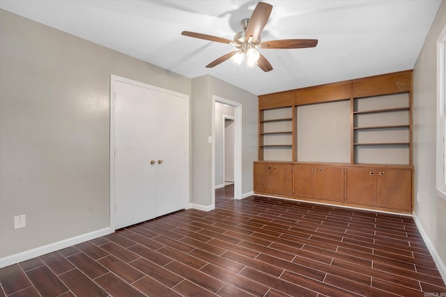 900 Melton Dr, Jonesboro, AR 72401 - empty room featuring a ceiling fan and dark wood finished floors