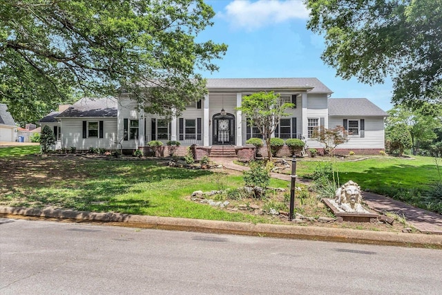 900 Melton Dr, Jonesboro, AR 72401 - colonial house featuring a front lawn