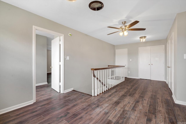 900 Melton Dr, Jonesboro, AR 72401 - corridor featuring an upstairs landing and wood finished floors