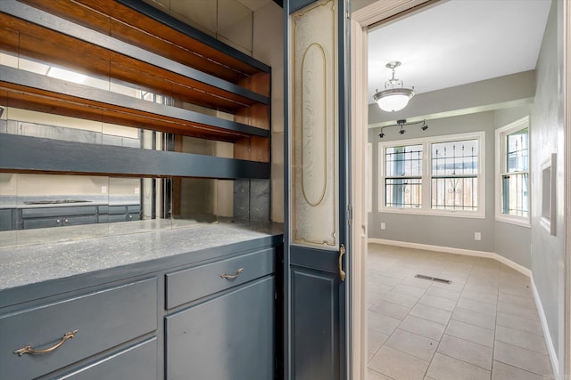 900 Melton Dr, Jonesboro, AR 72401 - kitchen featuring gray cabinetry, light tile patterned flooring, and open shelves