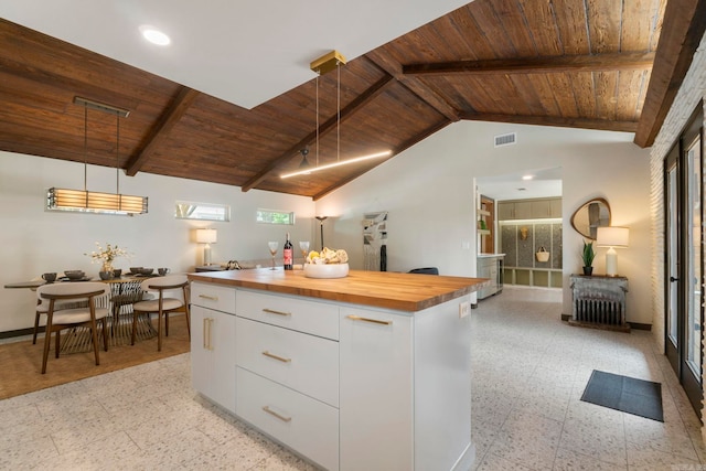 128 Dickson Dr, Little Rock, AR 72207 - kitchen with wooden ceiling, wood counters, white cabinets, recessed lighting, and modern cabinets