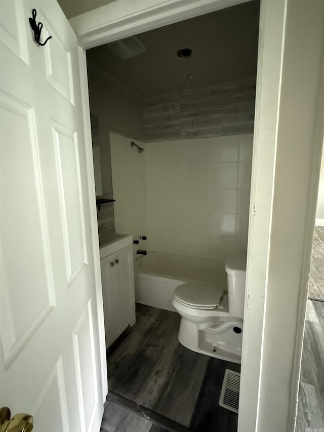 2417 Wolfe St, Little Rock, AR 72206 - bathroom featuring wood finished floors, vanity, and shower / washtub combination