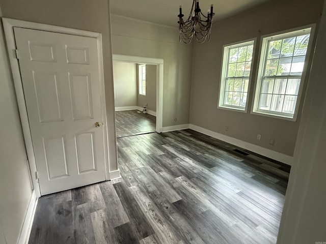 2417 Wolfe St, Little Rock, AR 72206 - unfurnished dining area with a chandelier and dark wood-style flooring