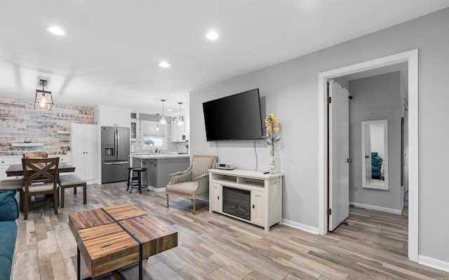 9 San Vincente Pl, Hot Springs Village, AR 71909 - living area featuring light wood-type flooring and recessed lighting