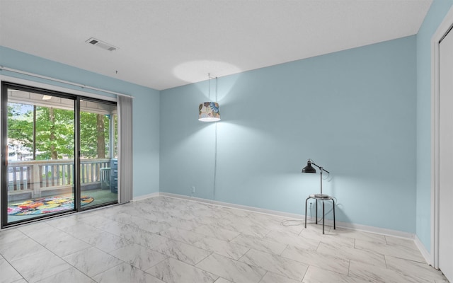 9 San Vincente Pl, Hot Springs Village, AR 71909 - empty room featuring marble finish flooring and baseboards