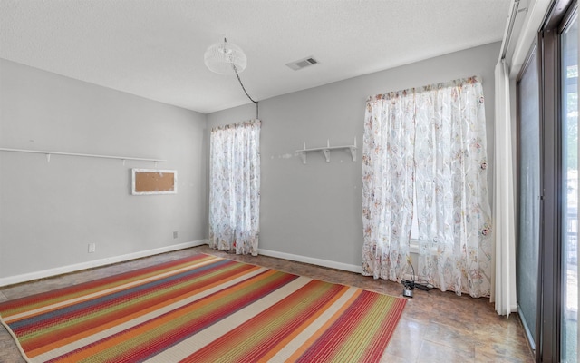 9 San Vincente Pl, Hot Springs Village, AR 71909 - unfurnished bedroom with baseboards and a textured ceiling