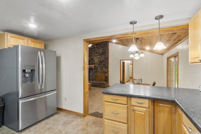 391 Bloodworth Rd, Searcy, AR 72143 - kitchen featuring stainless steel refrigerator with ice dispenser, dark countertops, a peninsula, light tile patterned flooring, and decorative light fixtures