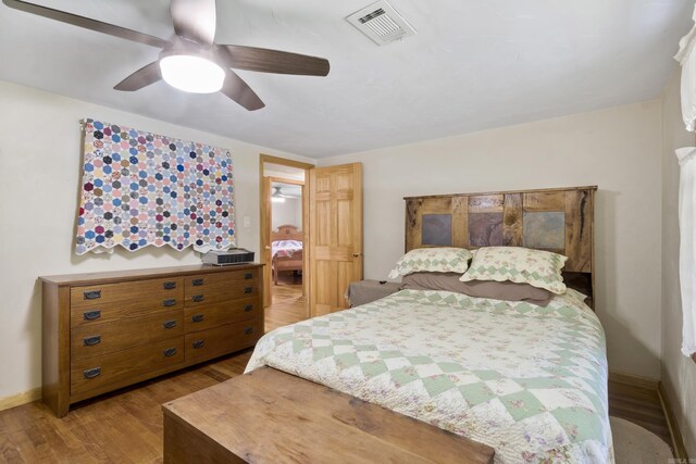 391 Bloodworth Rd, Searcy, AR 72143 - bedroom featuring wood finished floors and a ceiling fan
