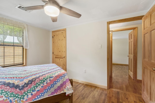 391 Bloodworth Rd, Searcy, AR 72143 - bedroom featuring light wood-type flooring, ornamental molding, and ceiling fan
