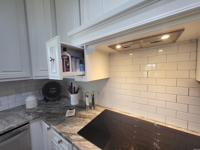 6413 Ram Rd, Mabelvale, AR 72103 - kitchen featuring stainless steel dishwasher, black electric cooktop, white cabinetry, decorative backsplash, and light stone countertops