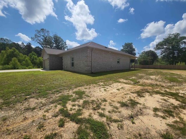 6413 Ram Rd, Mabelvale, AR 72103 - view of home's exterior with brick siding and a garage