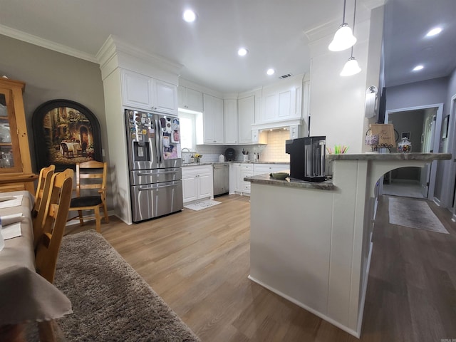 6413 Ram Rd, Mabelvale, AR 72103 - kitchen featuring stainless steel appliances, crown molding, a peninsula, white cabinets, and light wood-style flooring