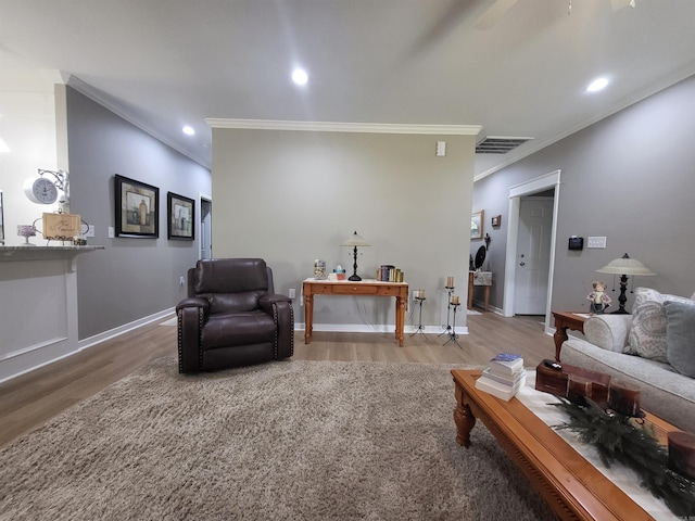 6413 Ram Rd, Mabelvale, AR 72103 - living area with ornamental molding, wood finished floors, and recessed lighting