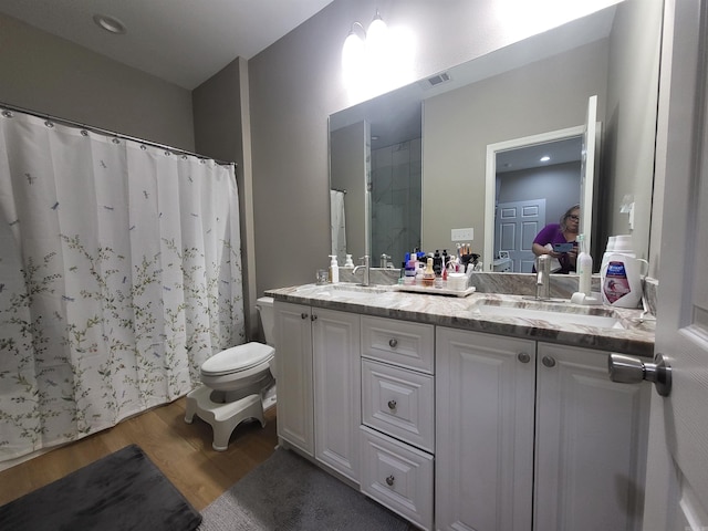 6413 Ram Rd, Mabelvale, AR 72103 - full bath with wood finished floors, double vanity, and a shower with shower curtain