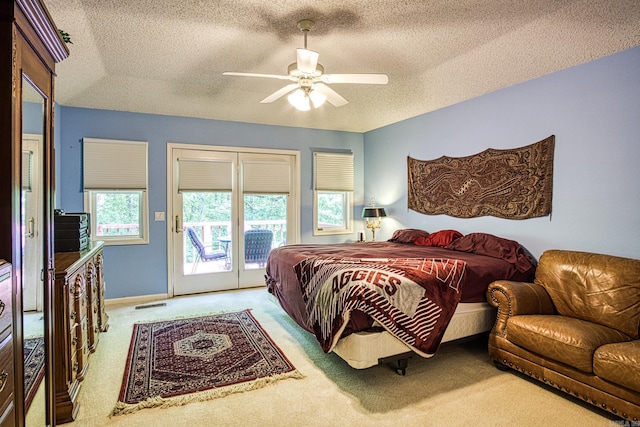 5 Lanza Ct, Hot Springs Village, AR 71909 - bedroom with access to exterior, carpet flooring, a textured ceiling, and ceiling fan