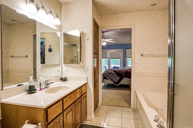5 Lanza Ct, Hot Springs Village, AR 71909 - ensuite bathroom with tile patterned flooring, a tub, a textured ceiling, vanity, and a ceiling fan