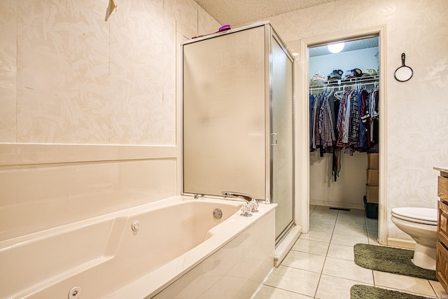 5 Lanza Ct, Hot Springs Village, AR 71909 - bathroom with a shower stall, a bath, tile patterned floors, and a spacious closet