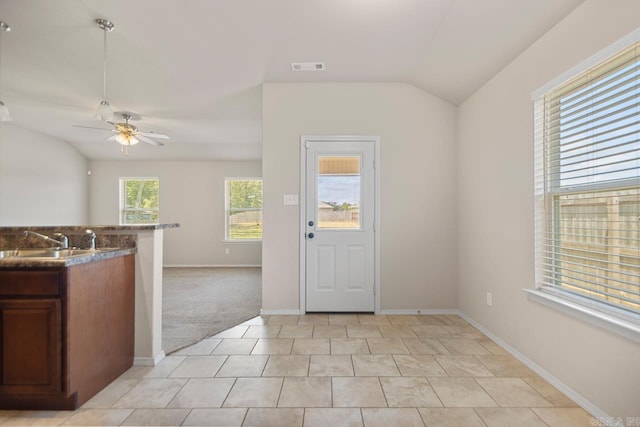 9701 Zuber, Alexander, AR 72002 - kitchen featuring vaulted ceiling, a ceiling fan, open floor plan, and light tile patterned floors