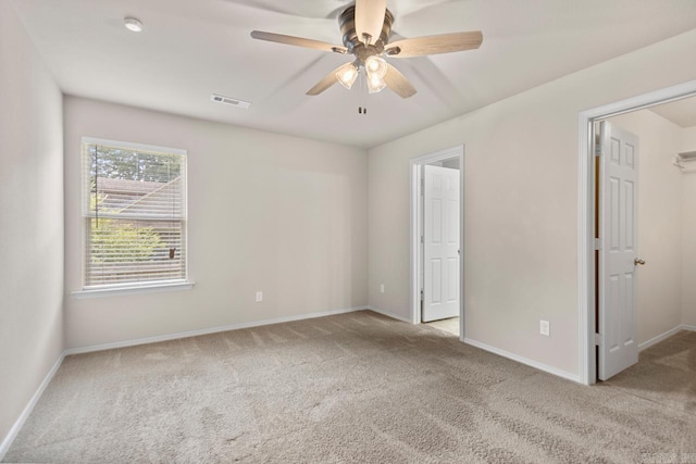 9701 Zuber, Alexander, AR 72002 - unfurnished bedroom featuring carpet flooring, a walk in closet, and a ceiling fan