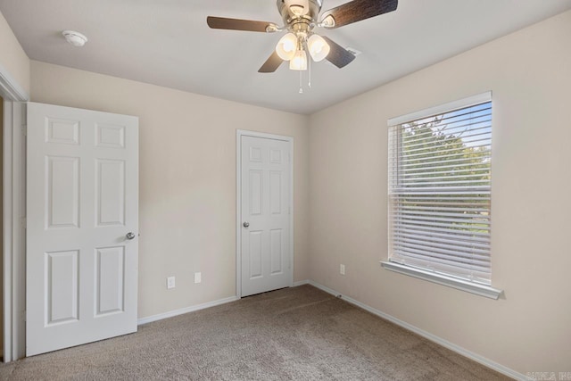 9701 Zuber, Alexander, AR 72002 - unfurnished bedroom featuring carpet flooring and ceiling fan