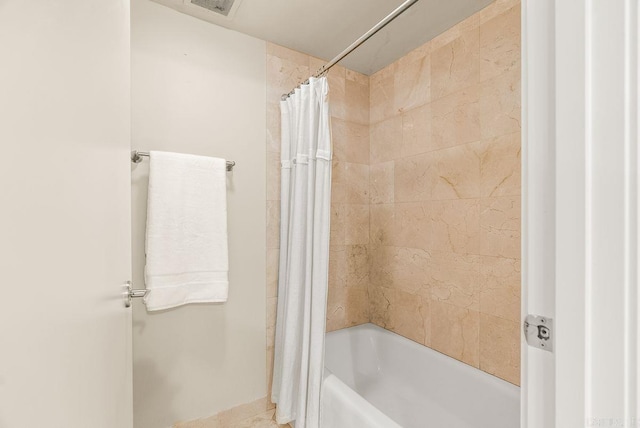 521 E President Clinton Ave Unit 1402, Little Rock, AR 72201 - full bathroom featuring shower / tub combo with curtain