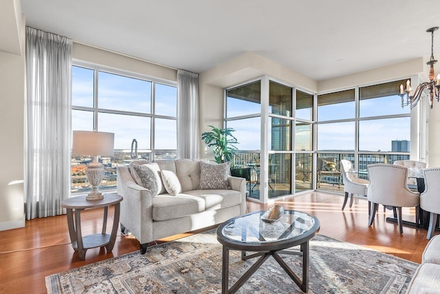521 E President Clinton Ave Unit 1402, Little Rock, AR 72201 - living area with a chandelier and wood finished floors