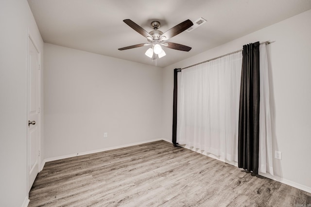 1375 Lacroix Ln, Conway, AR 72034 - unfurnished bedroom featuring wood finished floors and a ceiling fan